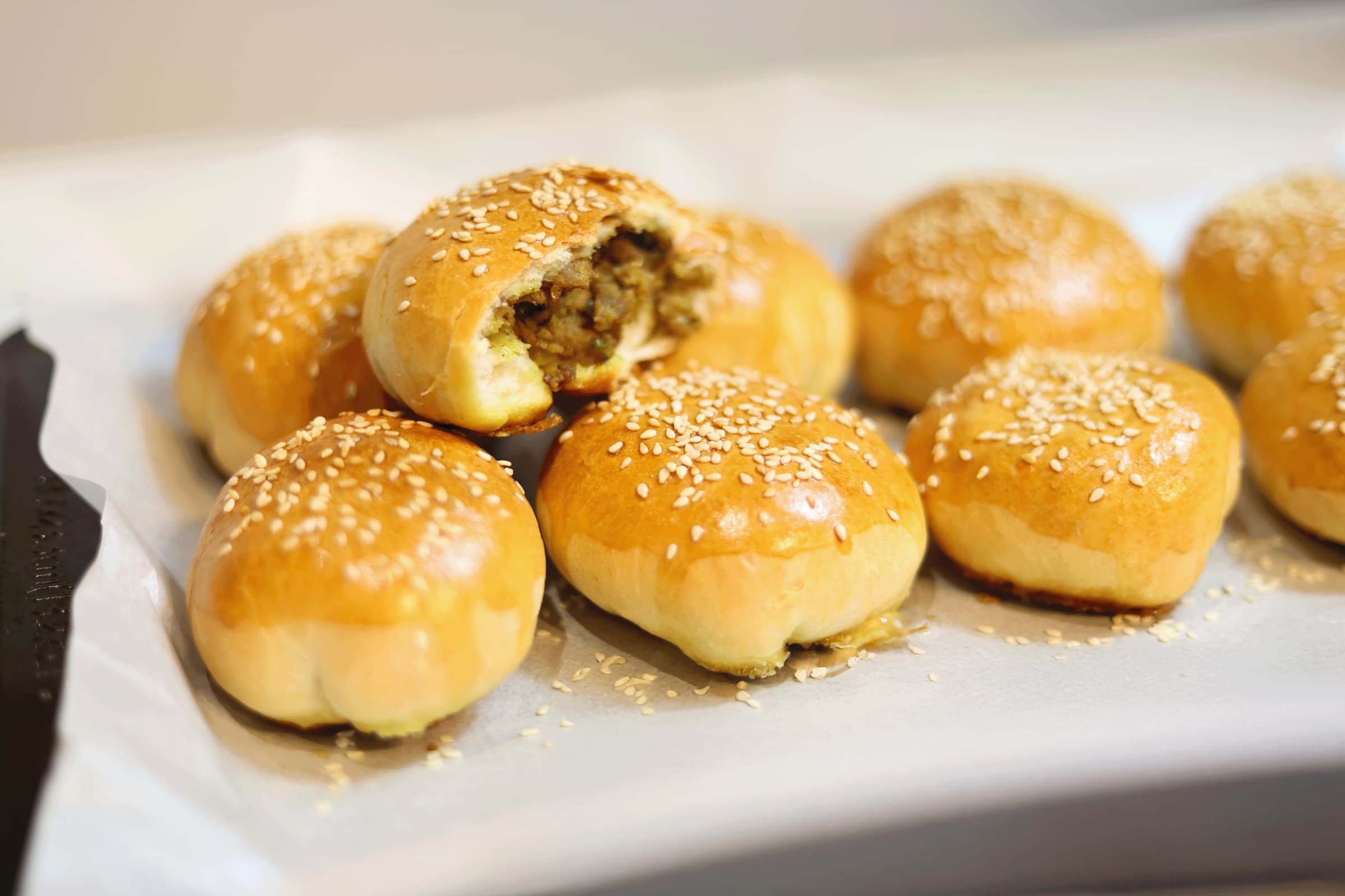 Freshly baked Sri Lankan fish buns on a tray