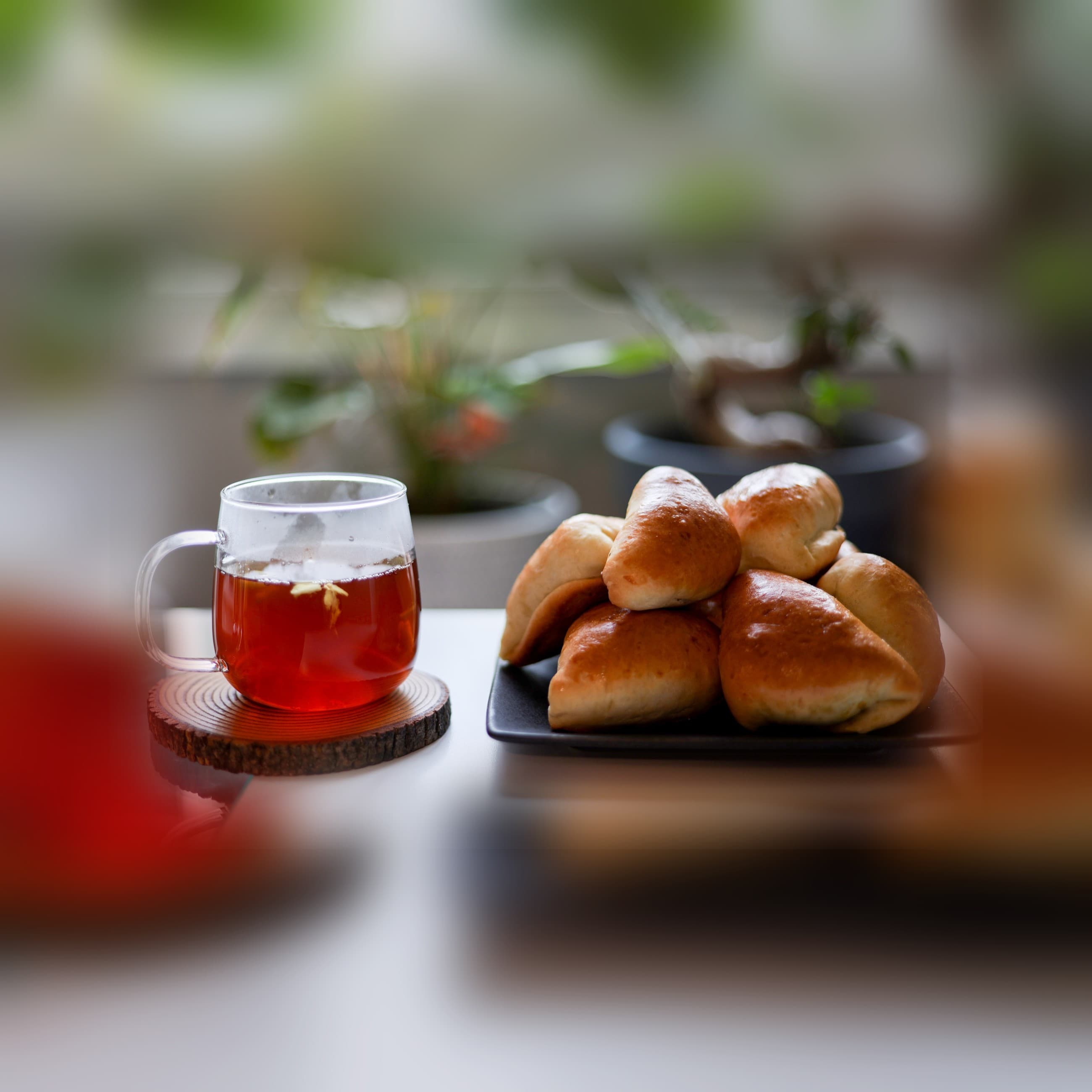 A plate of fresh short eats and a mug of tea at home